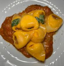 Torrisi signature dishes The menu is a prix-fixe format, but includes items like:Tortellini PomodoroCucumbers New YorkeseTableside Veal Chop